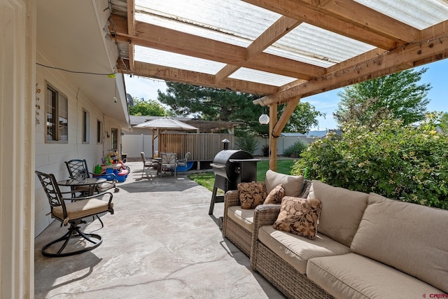 view of patio / terrace with fence, an outdoor living space, and a pergola