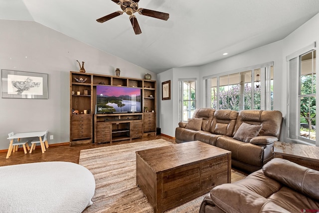 living room with lofted ceiling, baseboards, and a ceiling fan