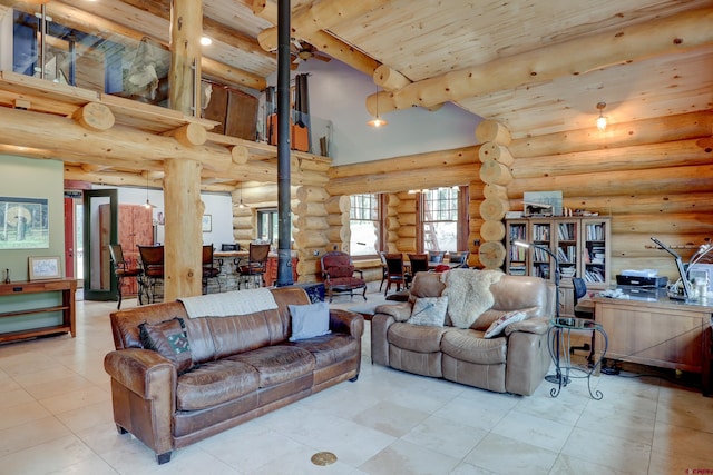 tiled living room with beamed ceiling, a wood stove, wood ceiling, rustic walls, and a towering ceiling