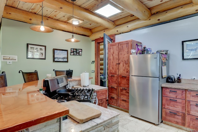 kitchen featuring light tile patterned flooring, hanging light fixtures, wooden ceiling, beamed ceiling, and stainless steel refrigerator