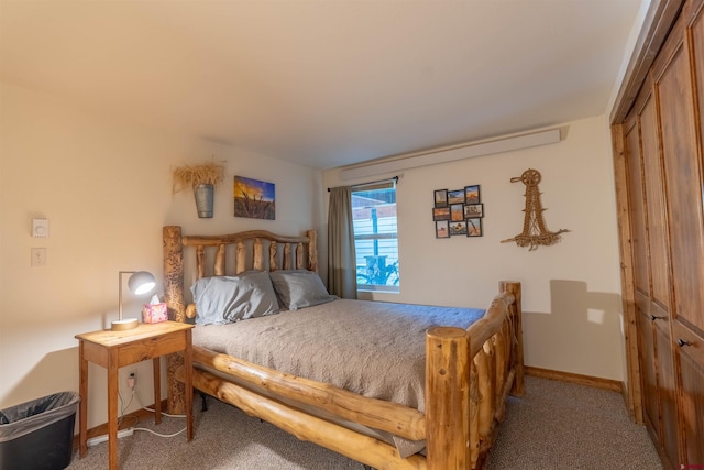 carpeted bedroom with a closet