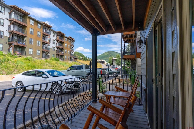 balcony featuring a mountain view