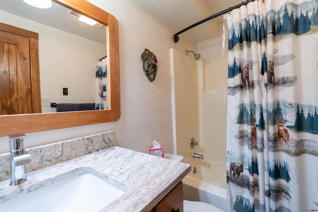 full bathroom featuring vanity, toilet, and shower / tub combo