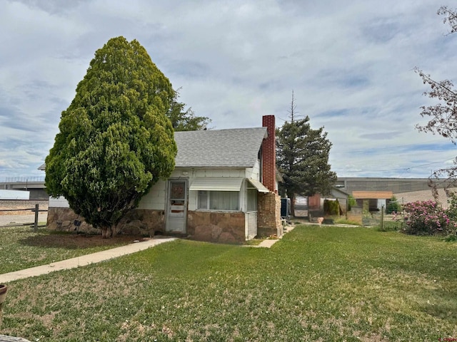 view of home's exterior featuring a yard