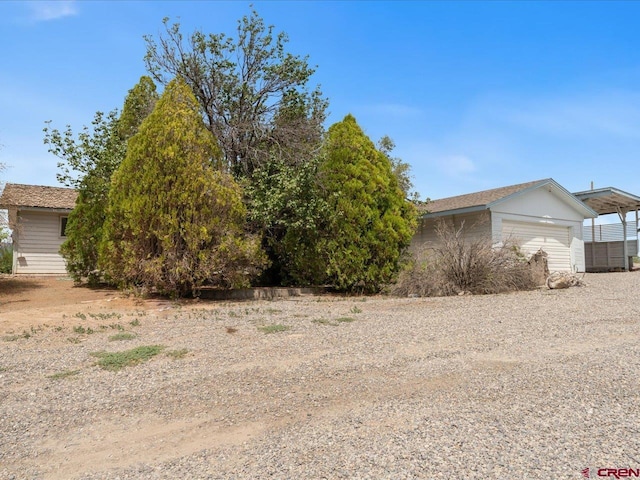 view of property exterior with a garage