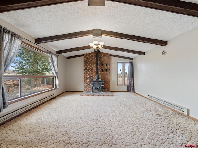 unfurnished living room with a textured ceiling, lofted ceiling with beams, a wood stove, and a baseboard heating unit