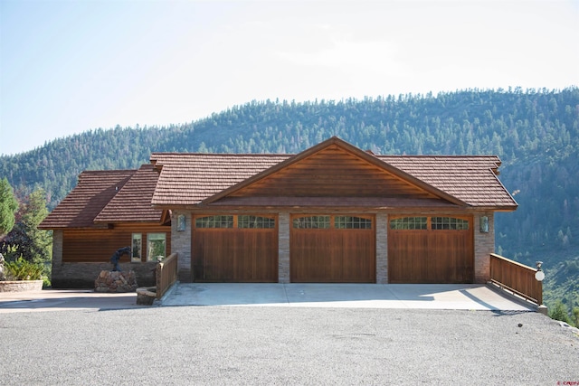 view of front of home featuring a mountain view