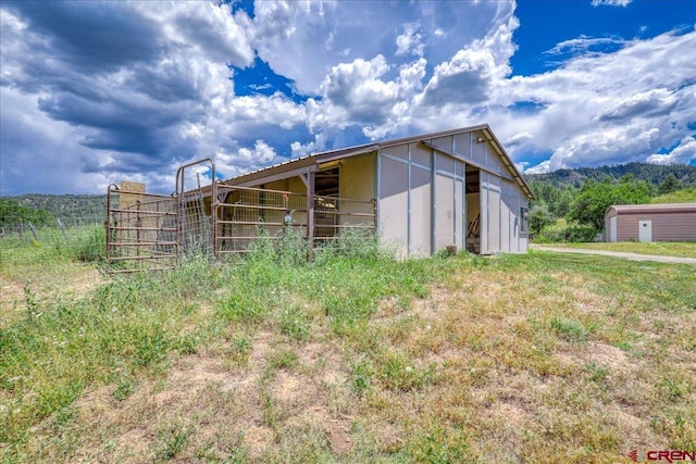 view of outbuilding featuring an outbuilding and an exterior structure