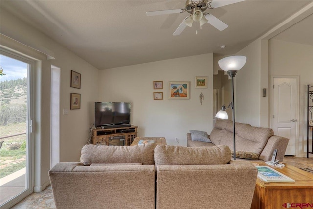 living room featuring lofted ceiling and a ceiling fan