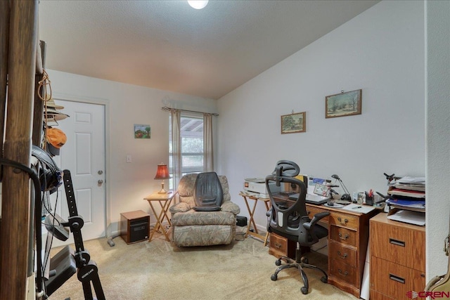 office area with light carpet and lofted ceiling