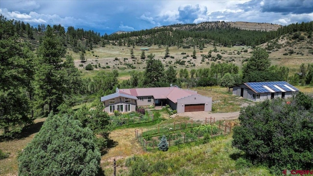 birds eye view of property featuring a rural view