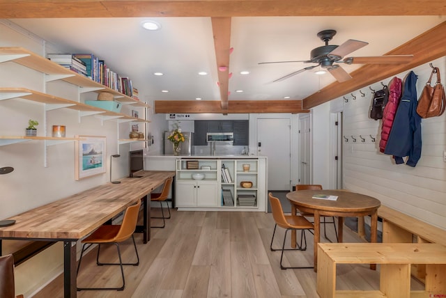 kitchen featuring white cabinets, ceiling fan, and light hardwood / wood-style floors