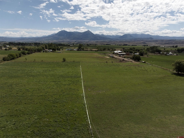 exterior space with a rural view and a mountain view