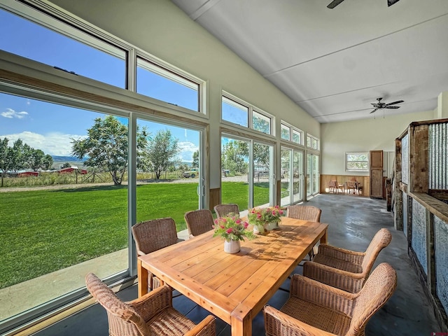 sunroom / solarium with a ceiling fan