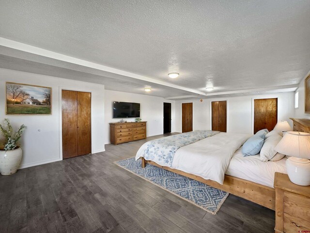 unfurnished living room featuring a wood stove, hardwood / wood-style flooring, and a textured ceiling