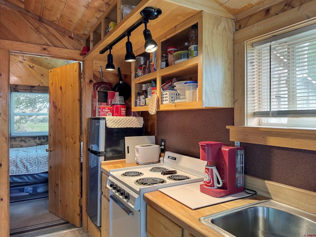 kitchen featuring wooden ceiling, electric stove, vaulted ceiling, and a healthy amount of sunlight