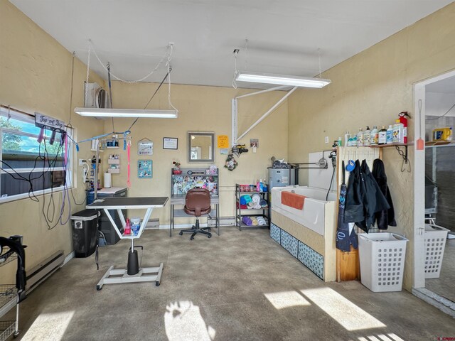 exercise room with ceiling fan, tile walls, tile patterned floors, and washing machine and clothes dryer