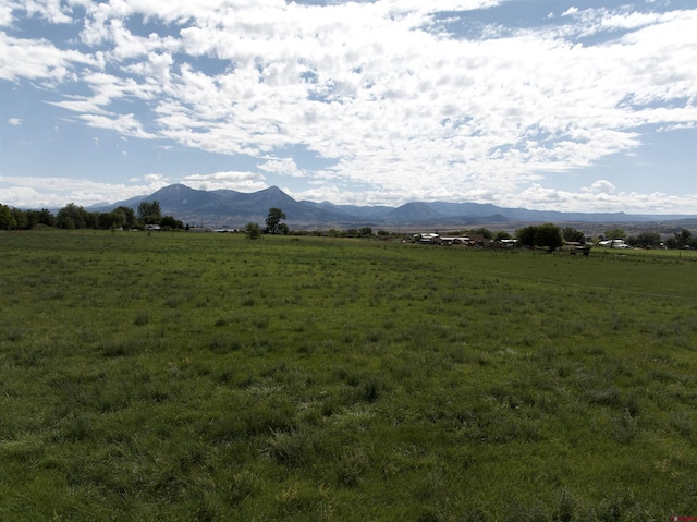 property view of mountains featuring a rural view