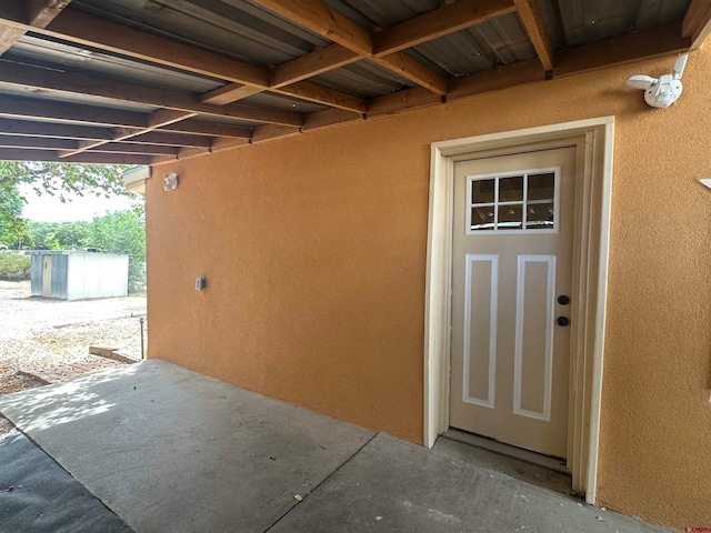 entrance to property featuring a patio area