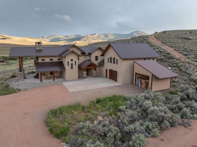 rear view of property featuring a mountain view