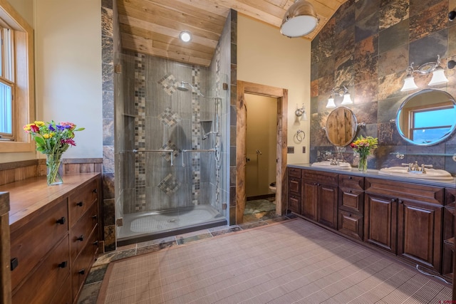 bathroom with a shower with shower door, tile walls, tile patterned flooring, and wood ceiling