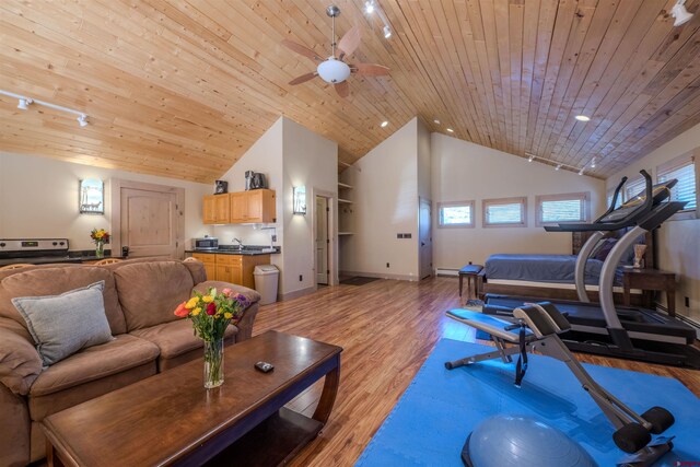 exercise room with ceiling fan, high vaulted ceiling, light hardwood / wood-style floors, and wooden ceiling