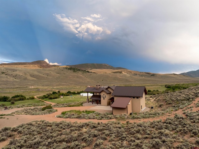 mountain view featuring a rural view