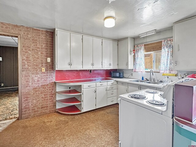 kitchen featuring baseboard heating, white appliances, sink, and light carpet