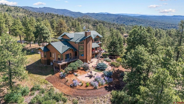 bird's eye view featuring a mountain view and a wooded view