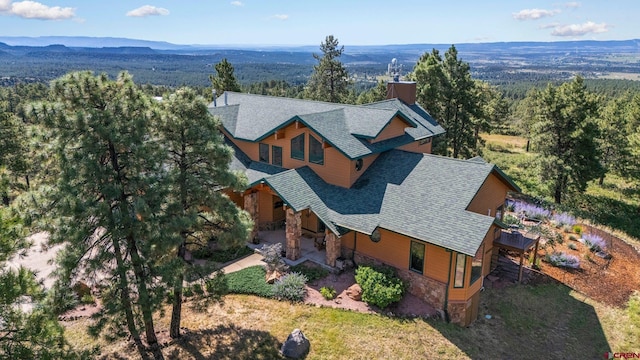 bird's eye view featuring a mountain view and a forest view