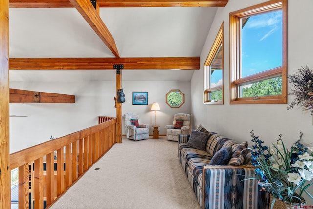 living room with lofted ceiling with beams and carpet floors