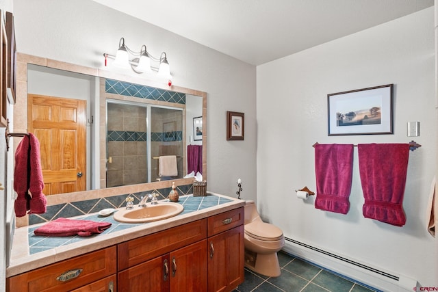 bathroom featuring tile patterned floors, toilet, a baseboard heating unit, a shower stall, and vanity