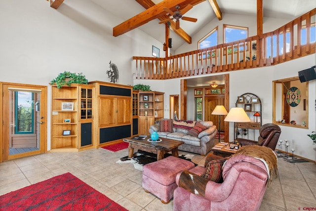 tiled living room featuring beam ceiling, high vaulted ceiling, and a ceiling fan