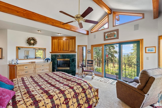 carpeted bedroom with beamed ceiling, multiple windows, a high end fireplace, and access to outside