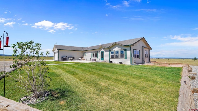 ranch-style house with a front lawn