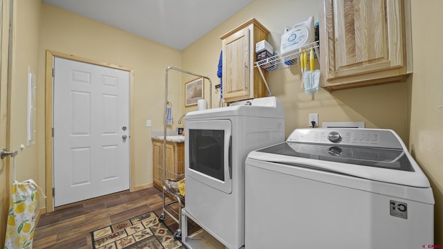37105 Ii Rd, Redvale, CO 81431 - laundry room featuring dark wood-type flooring, washer and dryer, and cabinet space