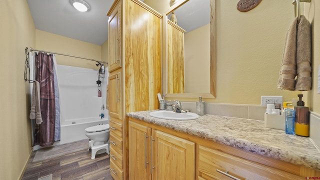 37105 Ii Rd, Redvale, CO 81431 - full bathroom featuring toilet, shower / bathing tub combination, wood finished floors, and vanity