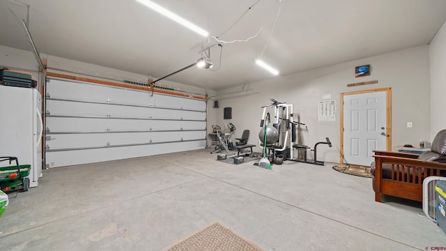 37105 Ii Rd, Redvale, CO 81431 - garage featuring a garage door opener and freestanding refrigerator