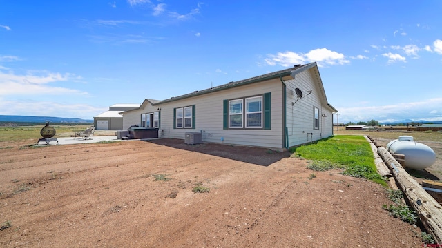 37105 Ii Rd, Redvale, CO 81431 - back of house with a patio and central AC unit