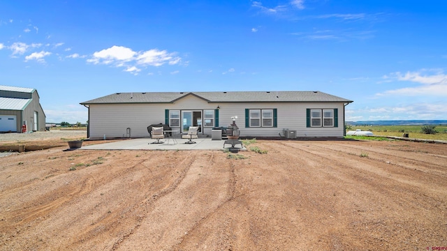 37105 Ii Rd, Redvale, CO 81431 - back of property featuring a patio and central AC unit