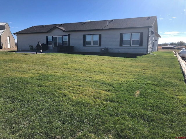 37105 Ii Rd, Redvale, CO 81431 - back of house with a yard, central AC, and a patio area