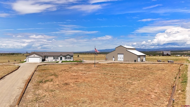37105 Ii Rd, Redvale, CO 81431 - view of yard with a rural view, an outdoor structure, and a mountain view