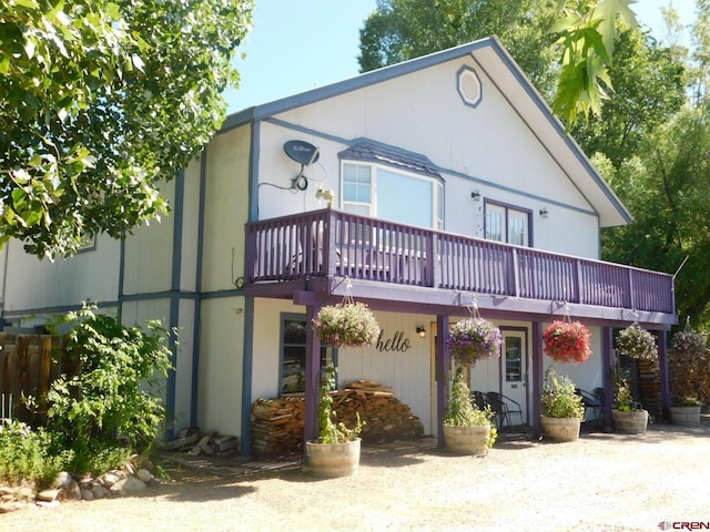 view of front of house with a balcony