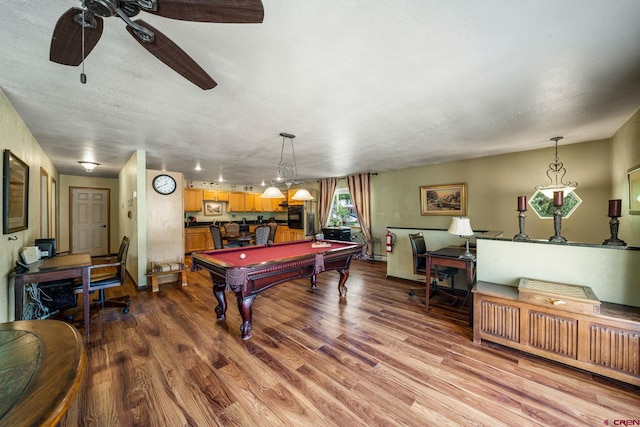 playroom with a textured ceiling, pool table, ceiling fan, and light hardwood / wood-style floors