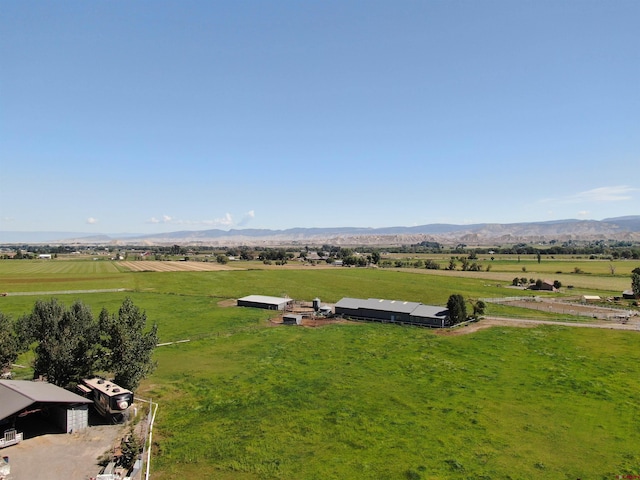 aerial view featuring a rural view and a mountain view