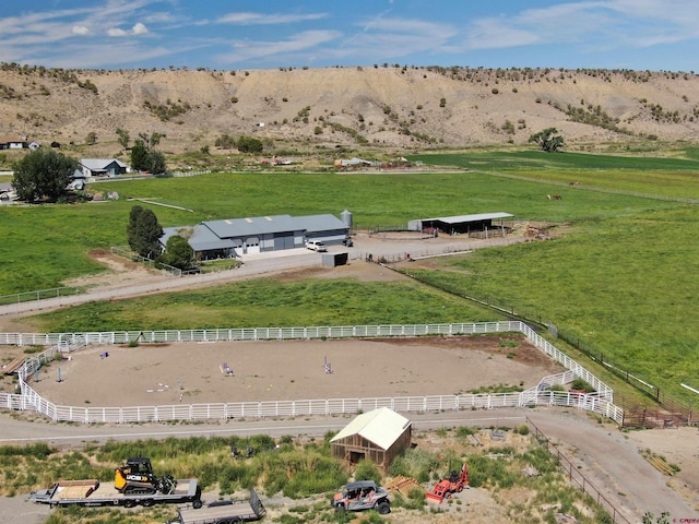 birds eye view of property with a rural view