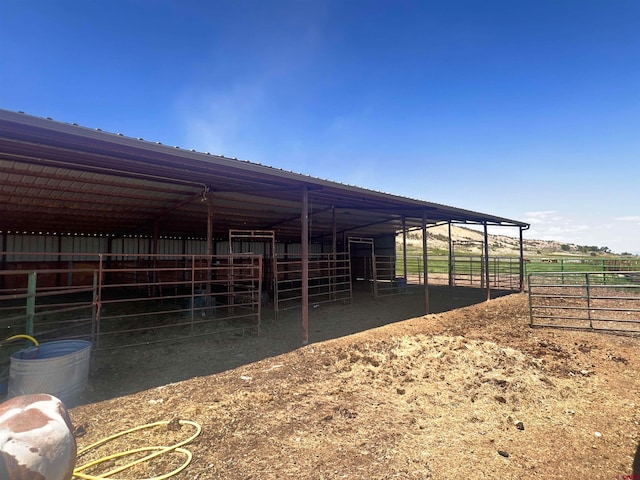 view of horse barn with an outdoor structure