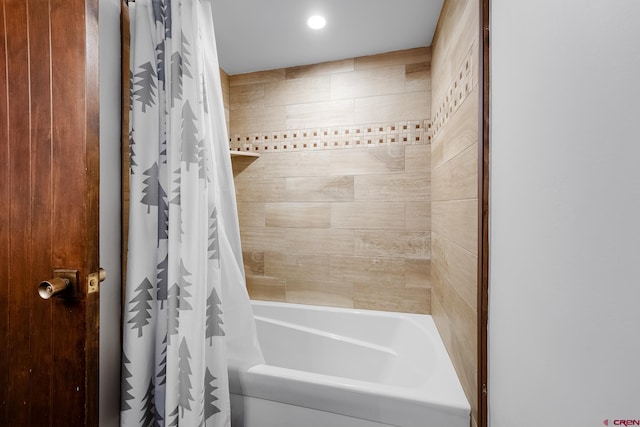 bathroom featuring shower / tub combo with curtain