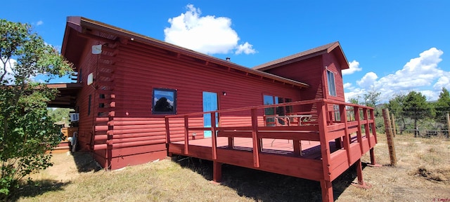 view of property exterior featuring a wooden deck