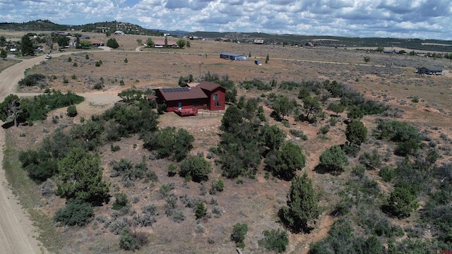 birds eye view of property with a rural view